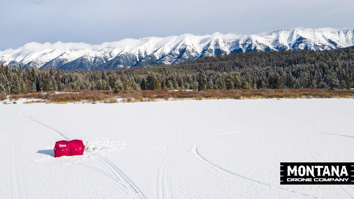 Ice Olation Montana Lake Ice Fishing Mountain Backdrop