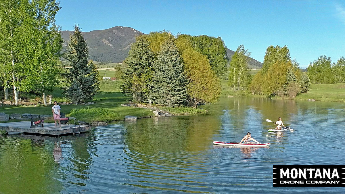 Montana Pond Paddle Boarding Kids Enjoying Summer Evening